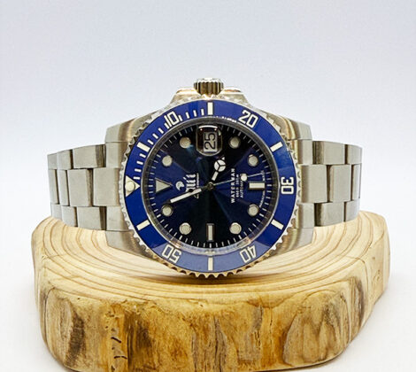 Waterman 41MM Blue Dial Blue Bezel Sports Watch sits on a piece of wood