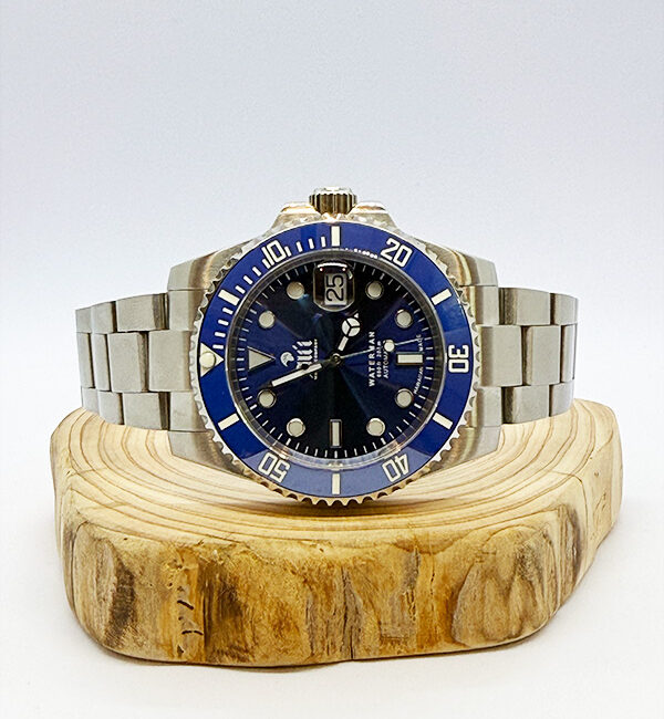 Waterman 41MM Blue Dial Blue Bezel Sports Watch sits on a piece of wood