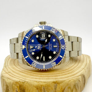 Ali'i Watch Company Waterman watch with a blue dial and bezel sits on a piece of wood.