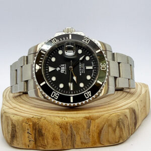 Ali'i Watch Company Waterman dive watch with a black dial and bezel sits on a piece of wood.