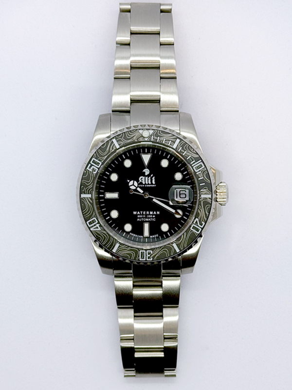Front view of the Ali'i Watch Company Waterman watch with black dial and black carbon fiber bezel.